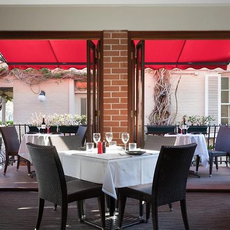Отель Ramada By Wyndham Brisbane Windsor Экстерьер фото